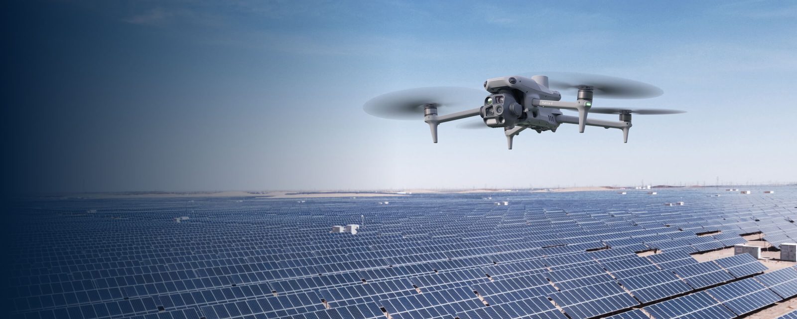 DJI thermal drone in flight over solar array